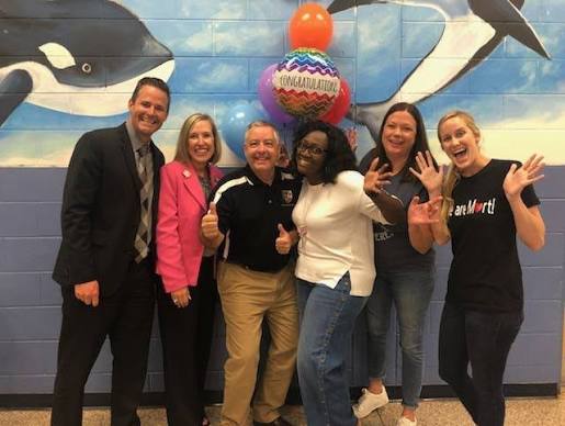 LaTiecea Brown with Mort Elementary team at award celebration